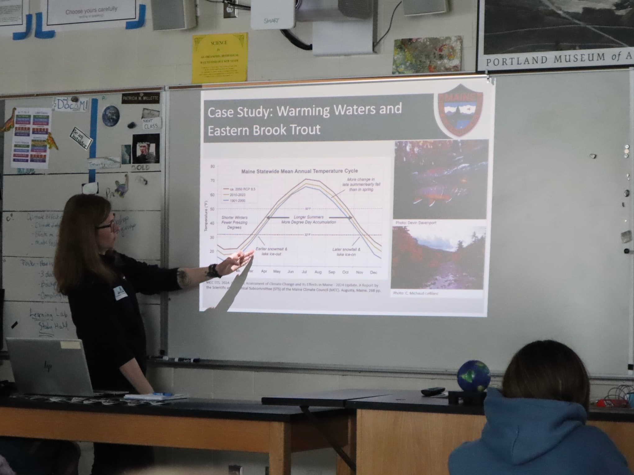 A presenter show data about changing temperatures and Eastern Brook Trout